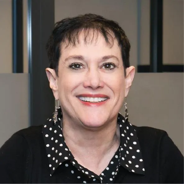 Mid aged woman with short hair and brown eyes