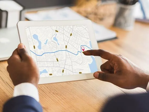 Person pointing on the virtual map on his tablet